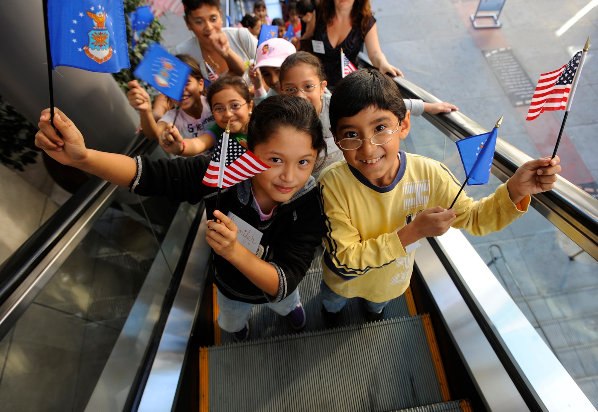 Bus loads of local school children make their way to the balconies of the Hollywood and Highland Plaza on Nov. 14 in Los Angeles for the proclamation ceremonies for Air Force Week-Los Angeles. The ceremonies included performances by the Air Force Honor Guard Drill Team and Air Force Band of the Golden West with flyovers by several different Air Force aircraft and interactive expos. Air Force Week-Los Angeles is Nov. 14 to 21 and has events throughout the area. (U.S. Air Force photo/Staff Sgt. Bennie J. Davis III) 