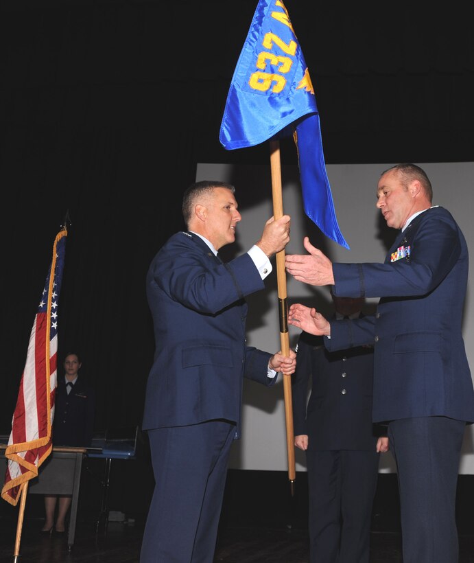 (Left)  932nd Airlift Wing commander Col. John C. Flournoy, Jr., passes the wing maintenance flag to Col. James McDonnell (right), who became the new maintenance group commander during a ceremony on November 9, 2008.  Col. McDonnell joins the wing after transferring from Tinker Air Force Base.  (U.S. Air Force photo/Tech. Sgt. Dan Oliver)