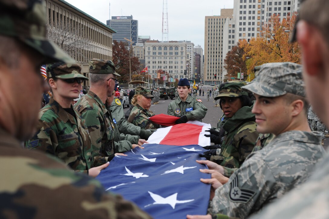 932nd Airlift Wing saluted the stars and stripes in addition to the veterans of the past and present.  They marched the large American flag through the streets of St. Louis to help celebrate Veterans Day 2008.  (U.S. Air Force/Tech. Sgt. Dan Oliver)