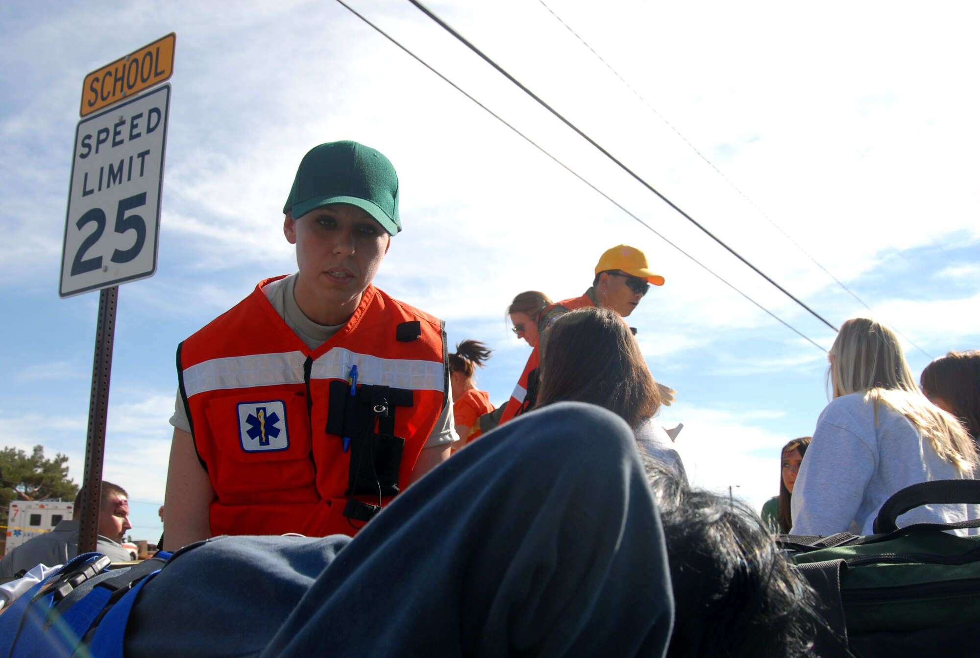 Staff Sgt. Jessica Reese, 95th Medical Group aerospace medical technician, talks to one of the victims of a simulated magnitude 7.8 earthquake as part of the Great Southern California Shakeout Nov. 13. (Air Force photo by Senior Airman Julius Delos Reyes)