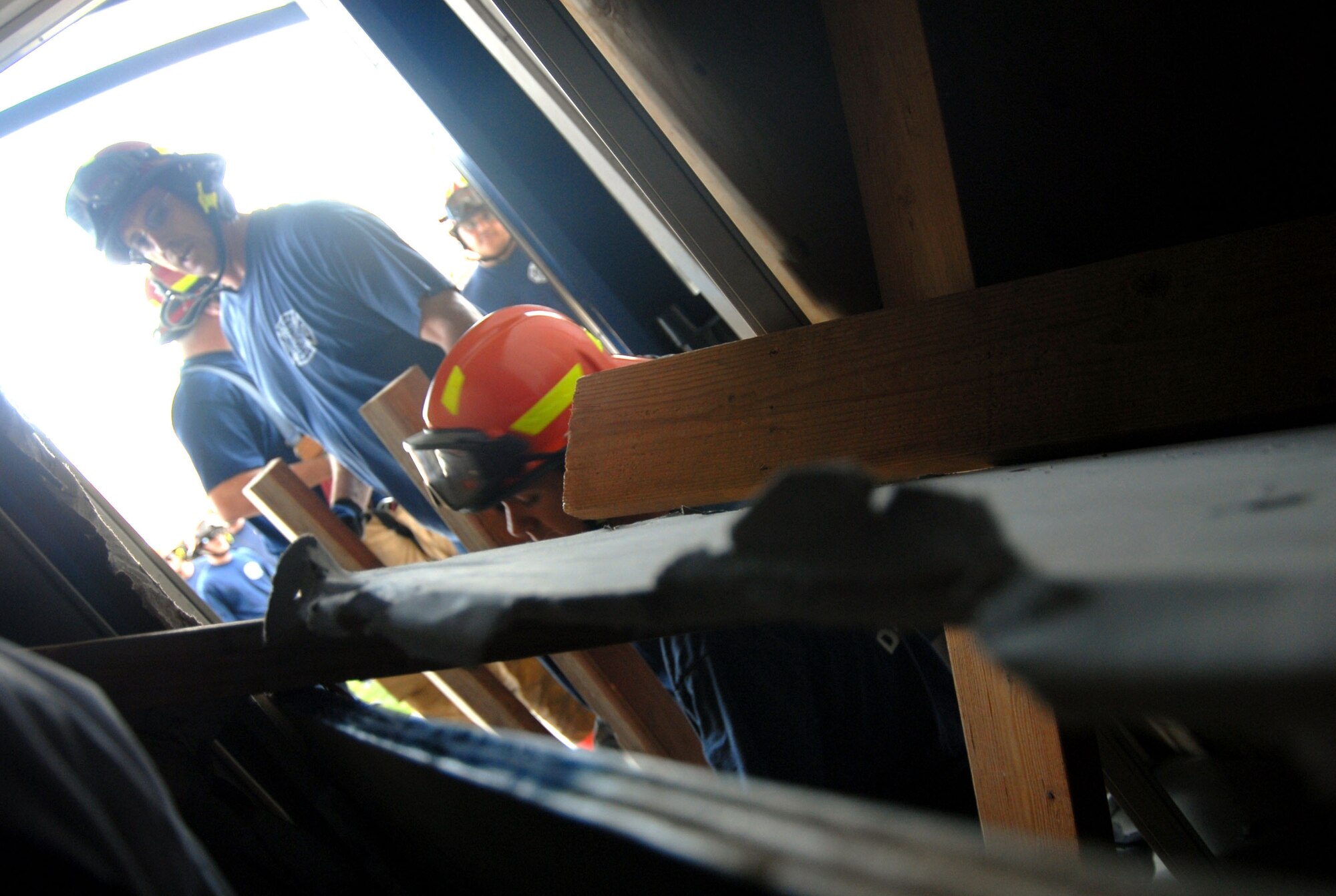 Edwards firefighters inspect a school building to ensure safe evacuation of trapped victims from a simulated magnitude 7.8 earthquake. The base participated in the Great Southern California Shakeout exercise that tests California's capability to respond and recover during a major earthquake. (Air Force photo by Senior Airman Julius Delos Reyes)