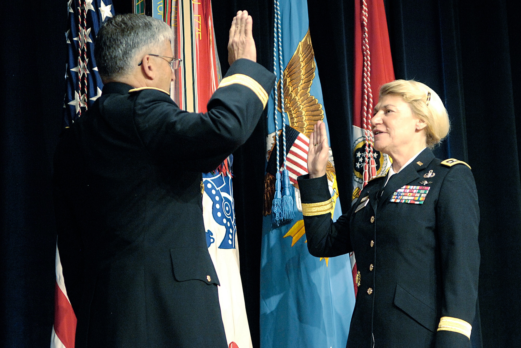 Chief of Staff of the Army Gen. George W. Casey administers the oath of office to Gen. Ann E. Dunwoody in during her promotion ceremony Nov. 14 at the Pentagon. General Dunwoody made history as the nation's first four-star female officer.  (Defense Department photo/Petty Officer 2nd Class Molly A. Burgess)