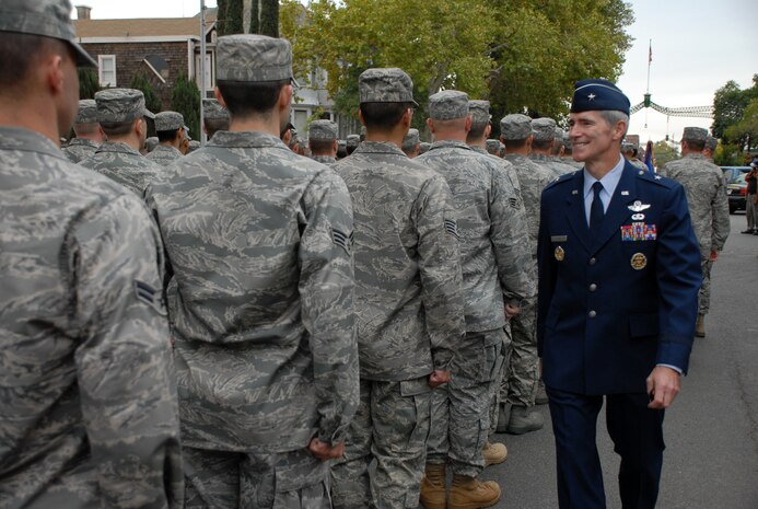Gen. Robert "Bob" Otto, 9th Reconnaissance Wing commander, greets Beale Airmen who are formed up to participate in the Marysville Veterans Day parade Nov. 11. (Photo by Staff Sgt. Sarah Gregory)
