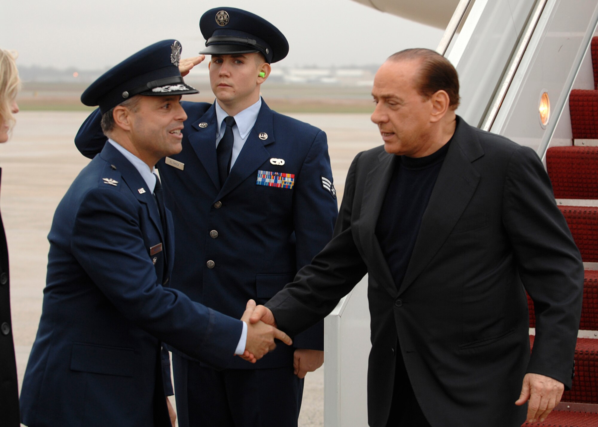 Colonel Eric A. Snadecki, 316th Wing vice commander, greets Italian Prime Minister Silvio Berlusconi at Andrews Air Force Base, Md., Nov. 14, 2008, for the two-day G20 Summit at the White House in Washington. The summit, hosted by U.S. President George W. Bush, will bring together world leaders to discuss the increasing global financial crisis, its causes and efforts to resolve it. (U.S. Air Force photo by Tech. Sgt. Craig Clapper)