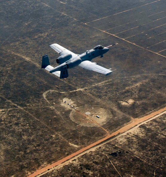 An A-10C Thunderbolt II, piloted by Maj. Matthew Domsalla, flies over what's left of a target Nov. 5 that was successfully hit by a Laser Joint Direct Attack Munition dropped by Major Domsalla. This was the first time an LJDAM weapon was dropped from an A-10.  The successful test moved this weapon capability for the A-10 closer to fielding for warfighters.  Major Domsalla is with the 40th Flight Test Squadron at Eglin Air Force Base, Fla.  (U.S. Air Force photo/Master Sgt. Joy Josephson)