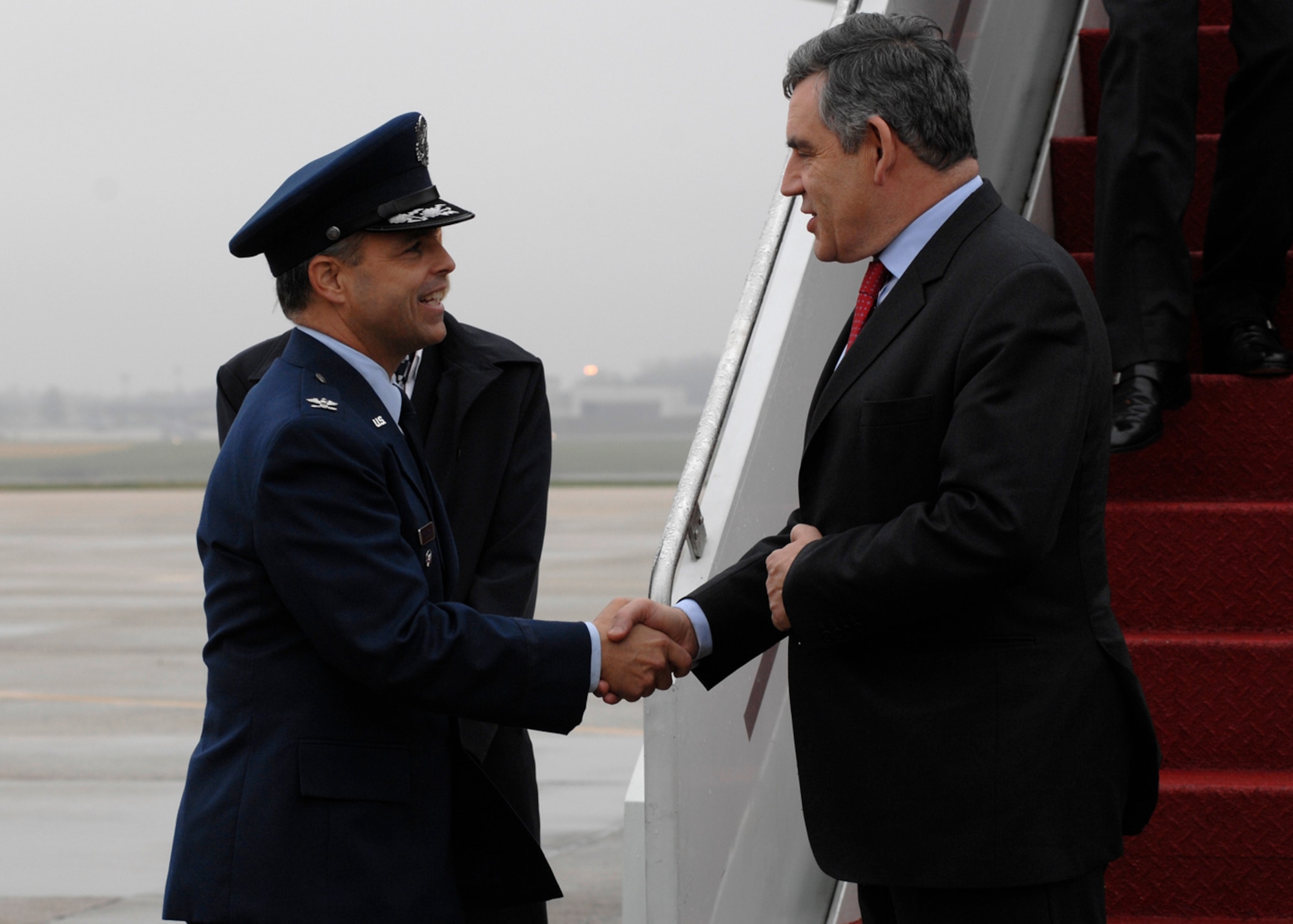 Colonel Eric A. Snadecki, 316th Wing vice commander, greets British Prime Minister Gordon Brown at Andrews Air Force Base, Md., Nov. 14, 2008, for the two-day G20 Summit at the White House in Washington. The summit, hosted by U.S. President George W. Bush, will bring together world leaders to discuss the increasing global financial crisis, its causes and efforts to resolve it. (U.S. Air Force photo by Senior Airman Melissa Stonecipher)