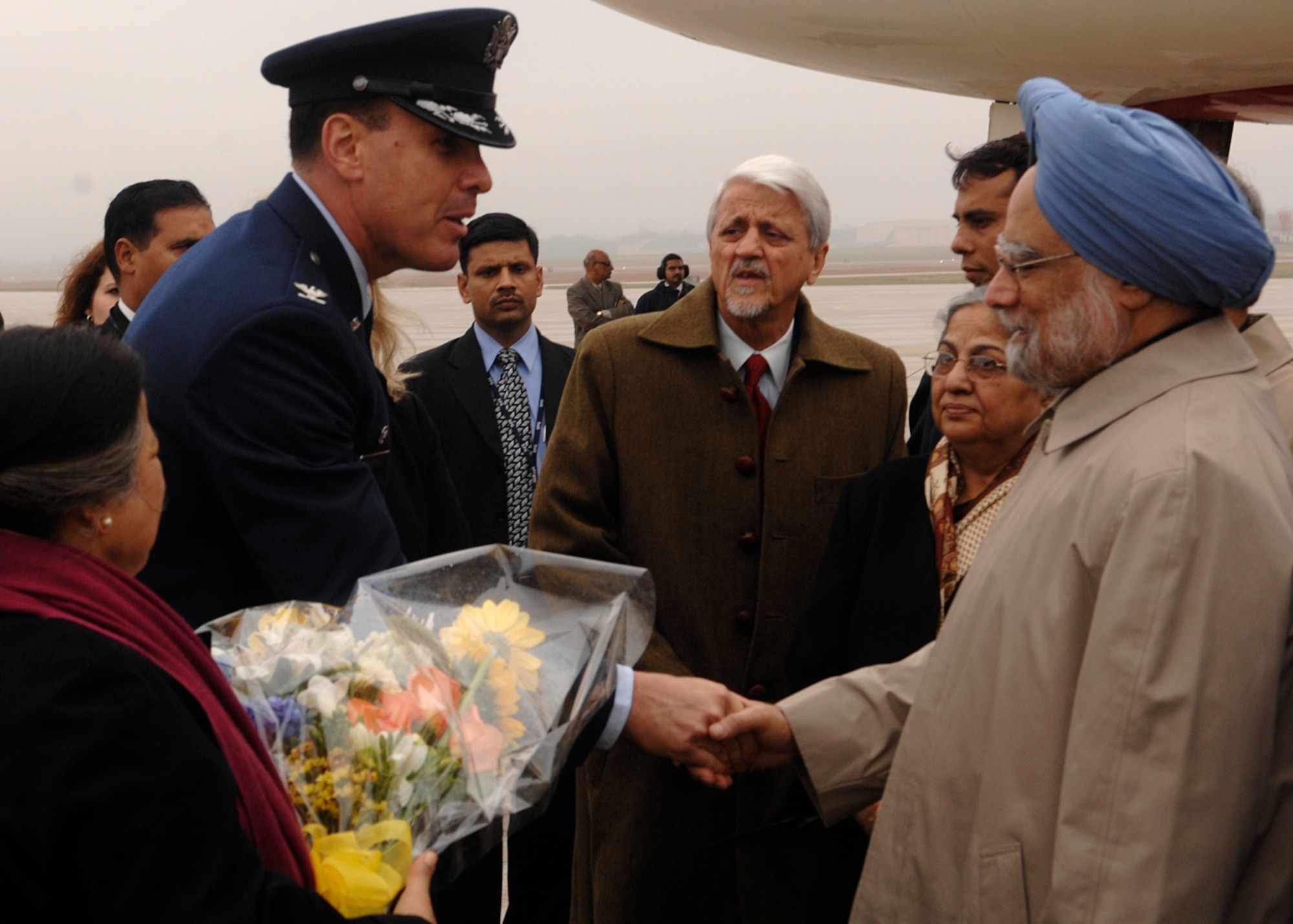 Colonel Steven M. Shepro, 316th Wing commander, greets Indian Prime Minister Manmohan Singh at Andrews Air Force Base, Md., Nov. 14, 2008, for the two-day G20 Summit at the White House in Washington. The summit, hosted by U.S. President George W. Bush, will bring together world leaders to discuss the increasing global financial crisis, its causes and efforts to resolve it. (U.S. Air Force photo by Tech. Sgt. Craig Clapper)