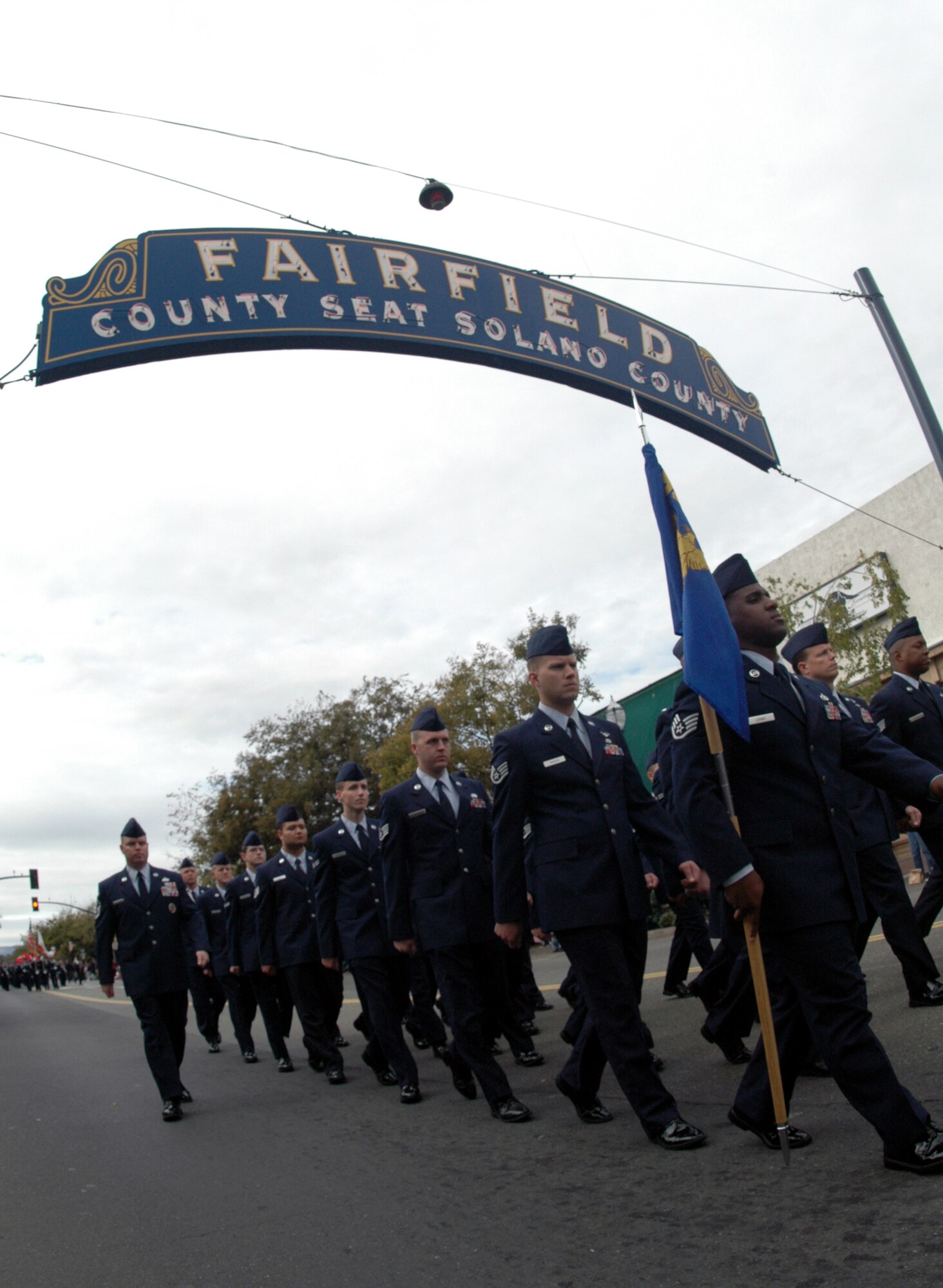 A flight of Airmen from the 60th Air Mobility Wing take part in the Fairfied Veterans Day Parade in Fairfield, Calif. Nov. 11. (U.S. Air Force photo/Staff Sgt. Shaun Emery)