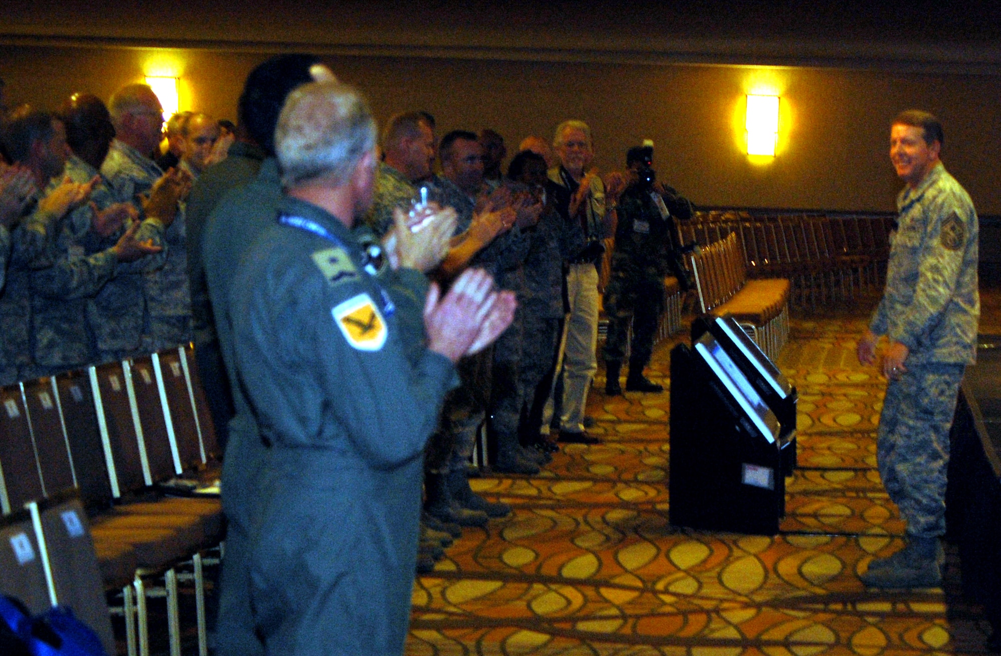 Chief Master Sgt. of the Air Force Rodney J. McKinley receives a standing ovation as he prepares to address hundred attendees to the 2008 Airlift/Tanker Association convention Nov. 7 in Anaheim, Calif.  Chief McKinley hit on numerous issues across the Air Force and noted that everywhere he goes the "thing that amazes me is our Airmen." (U.S. Air Force Photo/Tech. Sgt. Scott T. Sturkol)