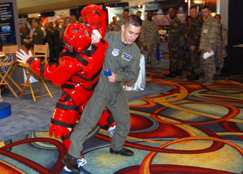 Staff Sgt. John Hoffecker and Master Sgt. Scott Pepper, both from the U.S. Air Force Expeditionary Center's 421st Combat Training Squadron at Fort Dix, N.J., perform a Phoenix Raven demonstration in the exhibit hall for the 2008 Airlift/Tanker Association convention Nov. 7 in Anaheim, Calif.  Throughout the convention, members of the USAF EC were on hand to not only perform the demonstrations for the thousands of convention attendees, but also to support the center's booth that showed the Expeditionary Center mission.  (U.S. Air Force Photo/Tech. Sgt. Scott T. Sturkol)