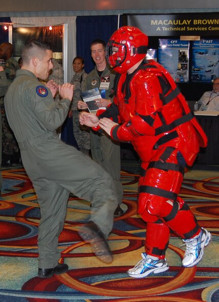 Staff Sgt. John Hoffecker and Master Sgt. Scott Pepper, both from the U.S. Air Force Expeditionary Center's 421st Combat Training Squadron at Fort Dix, N.J., perform a Phoenix Raven demonstration in the exhibit hall for the 2008 Airlift/Tanker Association convention Nov. 7 in Anaheim, Calif.  Throughout the convention, members of the USAF EC were on hand to not only perform the demonstrations for the thousands of convention attendees, but also to support the center's booth that showed the Expeditionary Center mission.  (U.S. Air Force Photo/Tech. Sgt. Scott T. Sturkol)