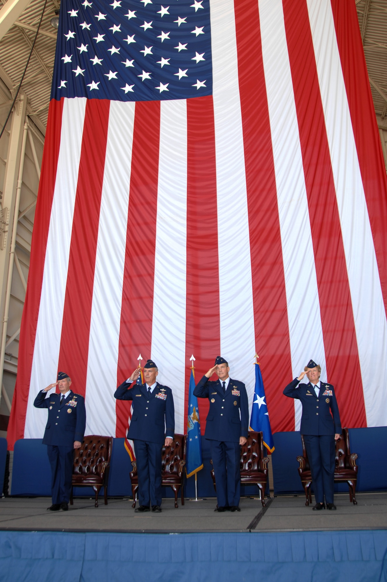 From left, Gen. Duncan J. McNabb, United States Transportation Command commander, Maj. Gen. Winfield W. Scott III, 18th Air Force commander, Brig. Gen. Mark E. Stearns, outgoing 15th Expeditionary Mobility Task Force commander and Brig. Gen. Barbara J. Faulkenberry, 15th Expeditionary Mobility Task Force commander, salute during the playing of the National Anthem during the 15th EMTF change of command ceremony at Travis Air Force Base, Calif.,  Nov. 13. (U.S. Air Force photo/Nan Wylie)