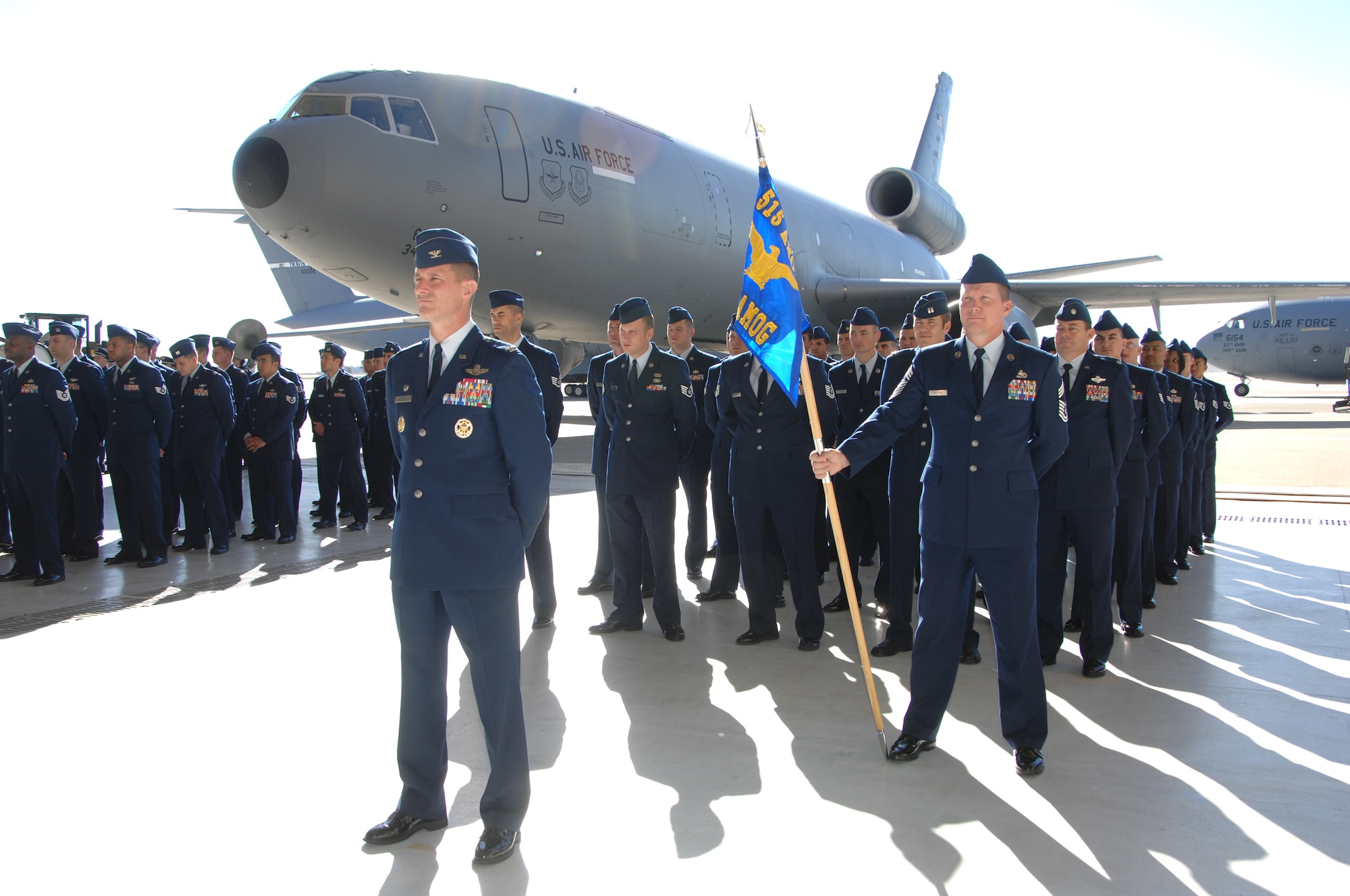 Members of the 515th Air Mobility Operations Wing, based in Hickam Air Force Base, Hawaii, stand in formation during the 15th Expeditionary Mobility Task Force change of command ceremony Nov. 13. (U.S. Air Force photo/Nan Wylie)