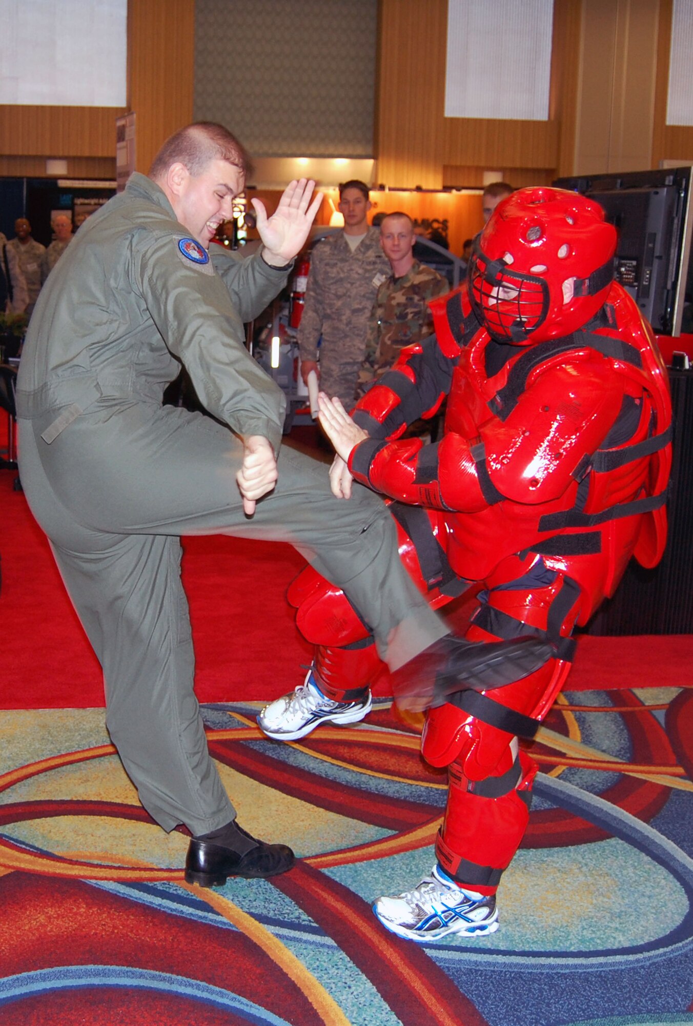 Tech. Sgt. Dan Koenigsmann and Master Sgt. Scott Pepper, from the U.S. Air Force Expeditionary Center's 421st Combat Training Squadron at Fort Dix, N.J., perform a Phoenix Raven demonstration in the exhibit hall for the 2008 Airlift/Tanker Association convention Nov. 7 in Anaheim, Calif.  Throughout the convention, Sergeants Koenigsmann and Pepper and other members of the USAF EC were on hand to not only perform the demonstrations for the thousands of convention attendees, but also to support the center's booth that showed the Expeditionary Center mission.  (U.S. Air Force Photo/Tech. Sgt. Scott T. Sturkol)
