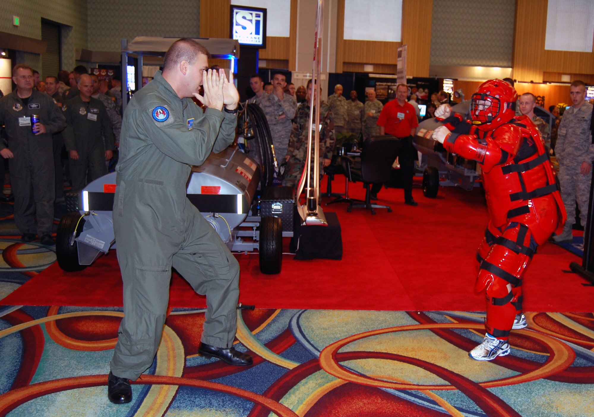 Tech. Sgt. Dan Koenigsmann and Master Sgt. Scott Pepper, from the U.S. Air Force Expeditionary Center's 421st Combat Training Squadron at Fort Dix, N.J., perform a Phoenix Raven demonstration in the exhibit hall for the 2008 Airlift/Tanker Association convention Nov. 7 in Anaheim, Calif.  Throughout the convention, Sergeants Koenigsmann and Pepper and other members of the USAF EC were on hand to not only perform the demonstrations for the thousands of convention attendees, but also to support the center's booth that showed the Expeditionary Center mission.  (U.S. Air Force Photo/Tech. Sgt. Scott T. Sturkol)
