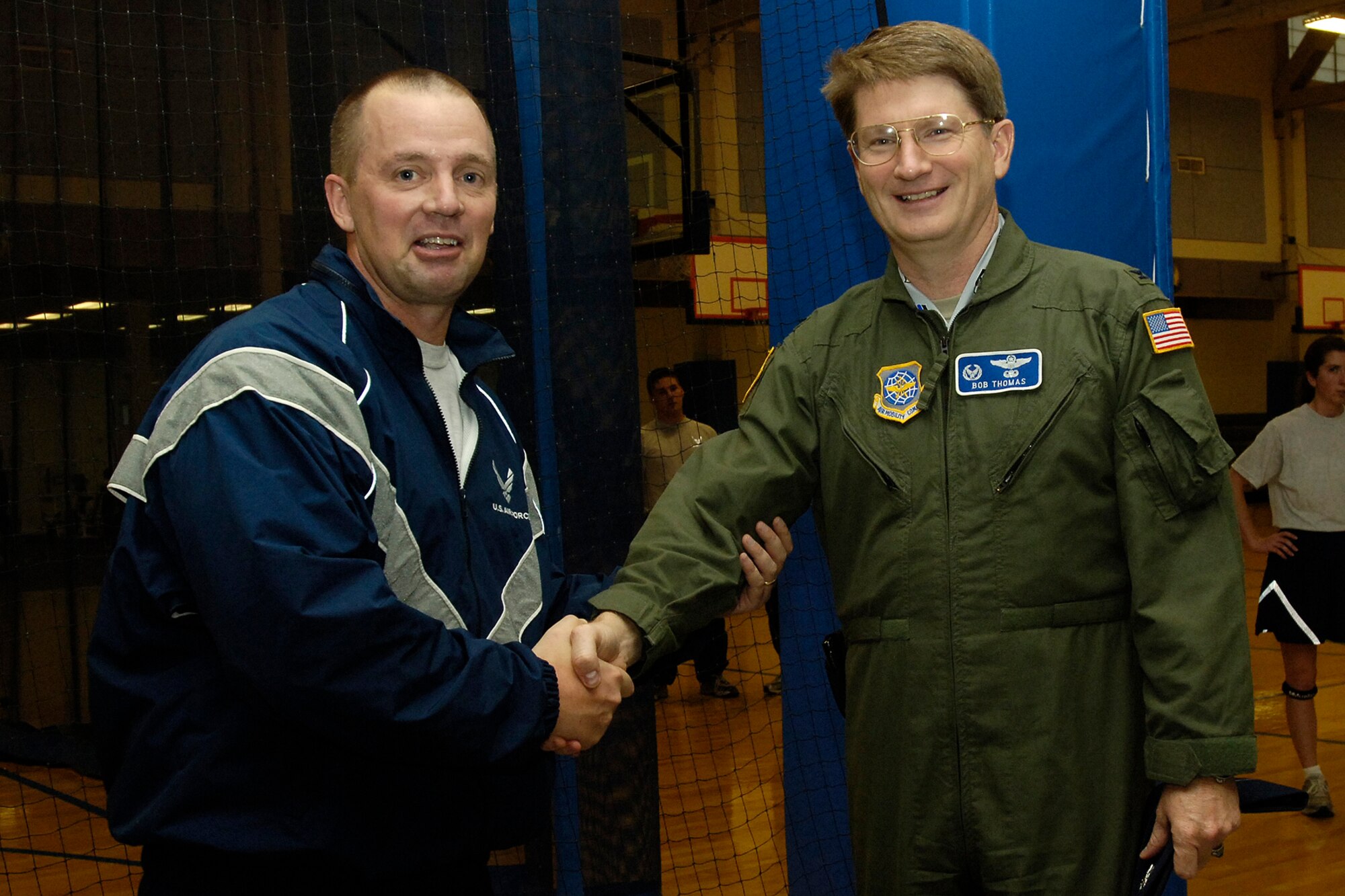 FAIRCHILD AIR FORCE BASE, Wash. – Col. Robert Thomas, 92nd Air Refueling Wing commander, congratulates Senior Master Sgt. Chad Brandau, 92nd Civil Engineer Squadron, on his selection for promotion to chief master sergeant, Nov. 12. Three of Fairchild’s senior master sergeants were selected. (U.S. Air Force photo / Senior Airman Eunique Stevens)