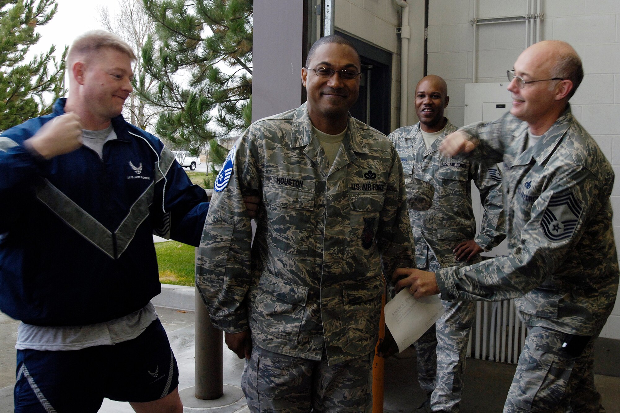 FAIRCHILD AIR FORCE BASE, Wash. – Senior Master Sgt. Reco Houston, 92nd Civil Engineer Squadron, gets his chief stripes tacked on by Lt. Col. Gregory Ottoman, 92nd CES commander and Chief Master Sgt. William Stamper, 92nd Maintenance Group superintendent, Nov. 12. Sergeant Houston is one of three Fairchild senior master sergeants chosen for promotion. (U.S. Air Force photo / Senior Airman Eunique Stevens)