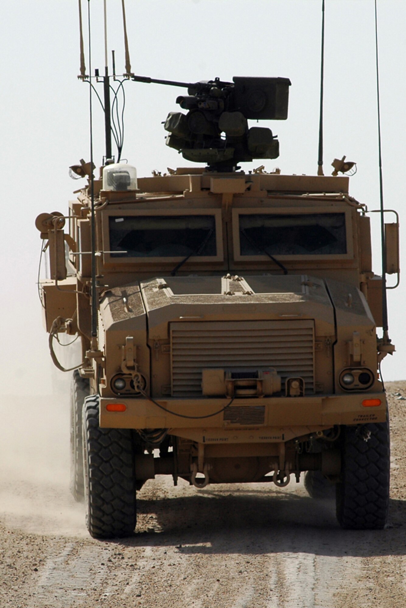 CAMP RAMADI, Iraq – An RG-33 heads back to the safety area carrying members of Special Operations Task Force-West after explosive ordinance disposal technicians performed a controlled detonation of recovered Iraqi munitions June 1. After the controlled blast, several members of SOTF-W had the opportunity to hone their skills on the RG33 remote weapons system at the firing range. (U.S. Air Force photo / Tech. Sgt. Larry W. Carpenter, Jr.)