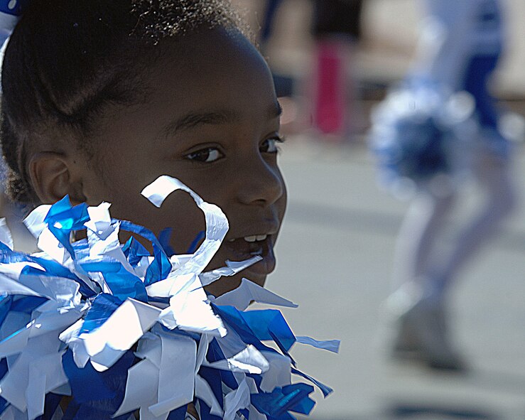 A group of cheerleaders from Holloman middle school cheer during the Veterans Day Parade Nov 8, in Alamogordo, N.M. Veterans Day is to honor America's fallen heroes, veterans and members who continue to serve. The Veterans Day National Ceremony is held each year on November 11th at Arlington National Cemetery.(U.S. Air Force photo/ Senior Airman Anthony Nelson)