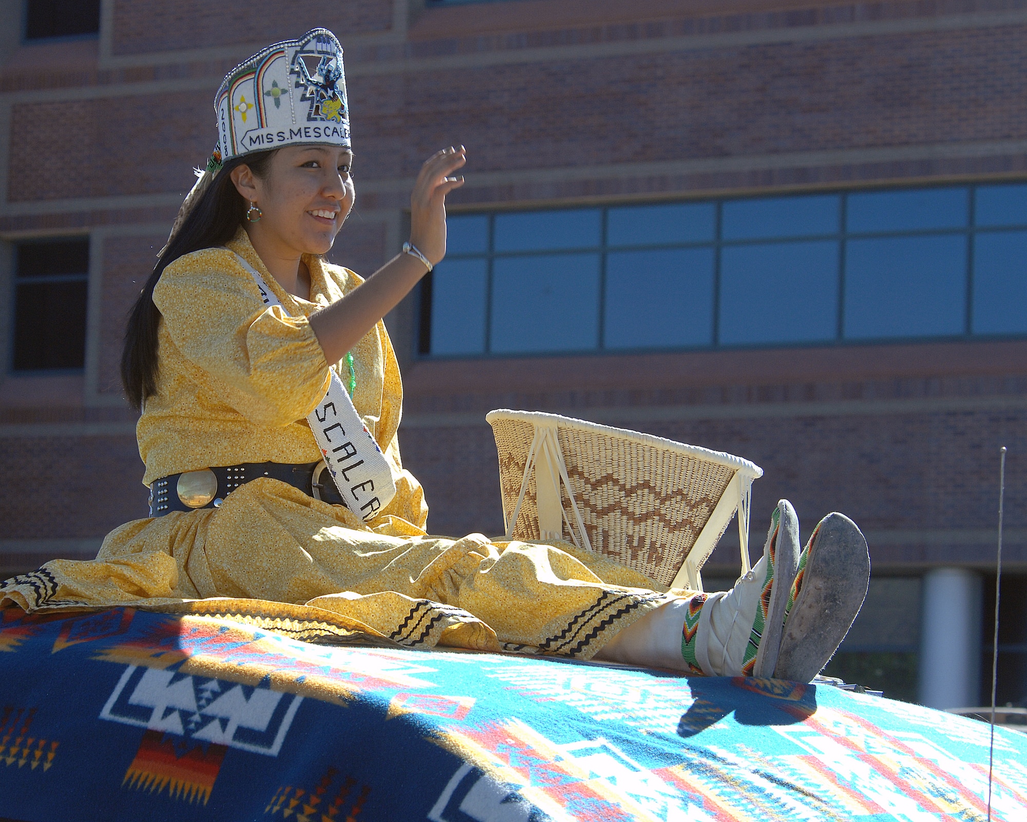 Miss Mescalero rides on top of a vechicle during the Veterans Day parade, Nov. 8, in Alamogordo, N.M.The Veterans Day National Ceremony is held Nov. 11 each year at Arlington National Cemetery. A color guard made up of members from each of the military services, renders honors to America's war dead during a tradition-rich ceremony at the Tomb of the Unkowns.



(U.S. Air Force photo/ Senior Airman Anthony Nelson)
