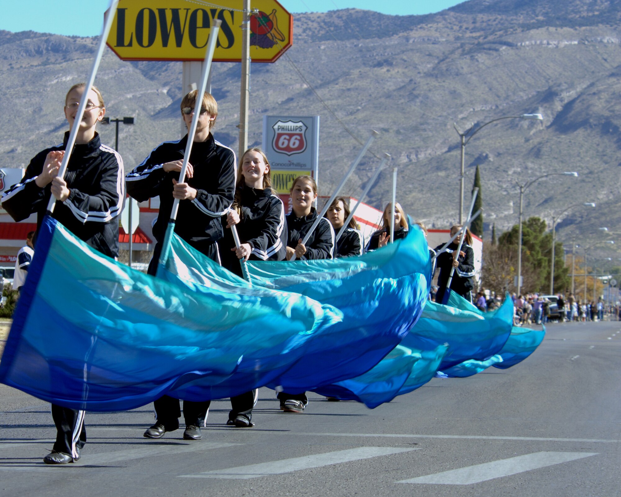 The Alamogordo High School color guard team marches down 10th Street during the Veterans Day parade, Nov. 8,  Alamogordo, N.M.The Veterans Day National Ceremony is held Nov. 11 each year at Arlington National Cemetery. A color guard made up of members from each of the military services, renders honors to America's war dead during a tradition-rich ceremony at the Tomb of the Unkowns.



(U.S. Air Force photo/ Senior Airman Anthony Nelson)
