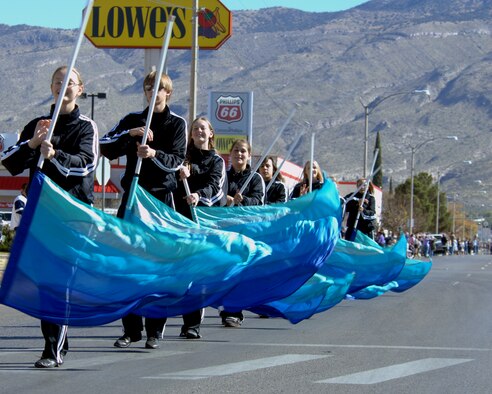 The Alamogordo High School color guard team marches down 10th Street during the Veterans Day parade, Nov. 8,  Alamogordo, N.M.The Veterans Day National Ceremony is held Nov. 11 each year at Arlington National Cemetery. A color guard made up of members from each of the military services, renders honors to America's war dead during a tradition-rich ceremony at the Tomb of the Unkowns.(U.S. Air Force photo/ Senior Airman Anthony Nelson)