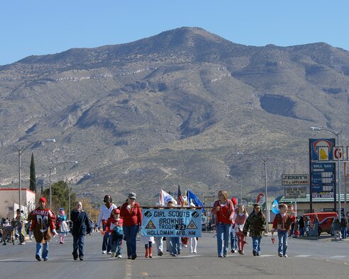 A group of girl scouts from Holloman Air Force Base, N.M., March down 10th Street during the Veterans Day parade Nov. 8, in Alamogordo, N.M. Veterans Day is to honor America's fallen heroes, veterans and members who continue to serve. The Veterans Day National Ceremony is held Nov. 11 each year at Arlington National Cemetery.(U.S. Air Force photo/ Senior Airman Anthony Nelson)