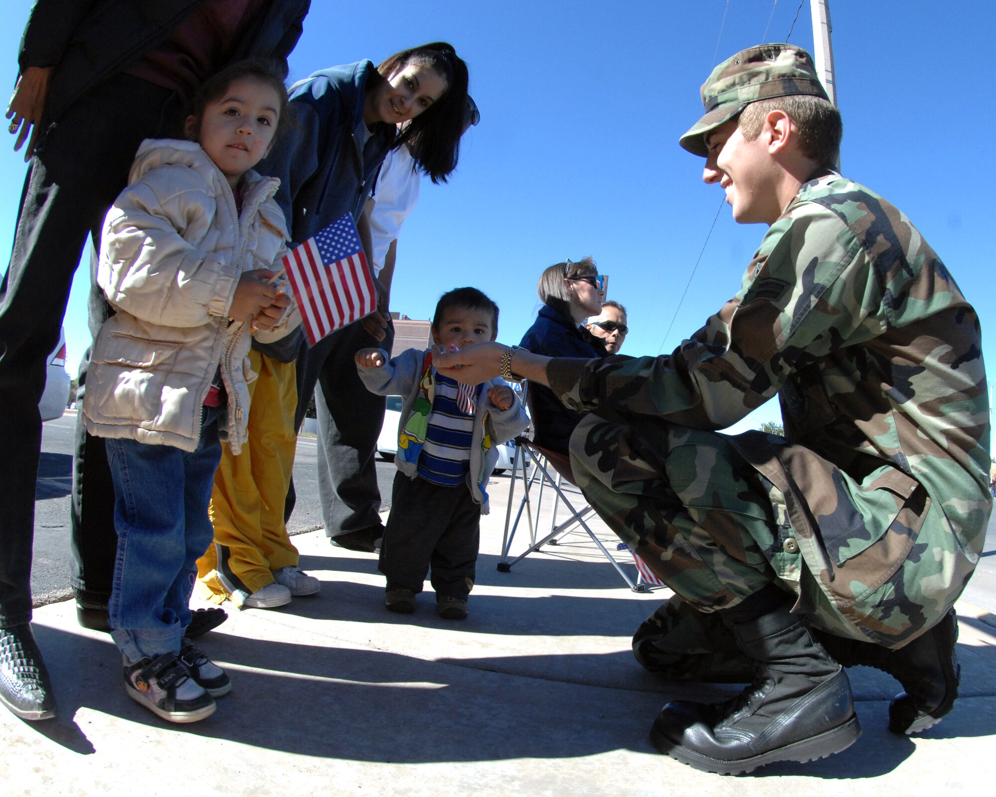 Airman 1st Class Collier Buffington, 49th Logisitics Readiness Squadron, Holloman Air Force Base, N.M., passes out candy to children during the Veterans Day parade Nov. 8, in Alamogordo, N.M. The Veterans Day National Ceremony is held Nov. 11 each year at Arlington National Cemetery.



(U.S. Air Force photo/ Senior Airman Anthony Nelson)
