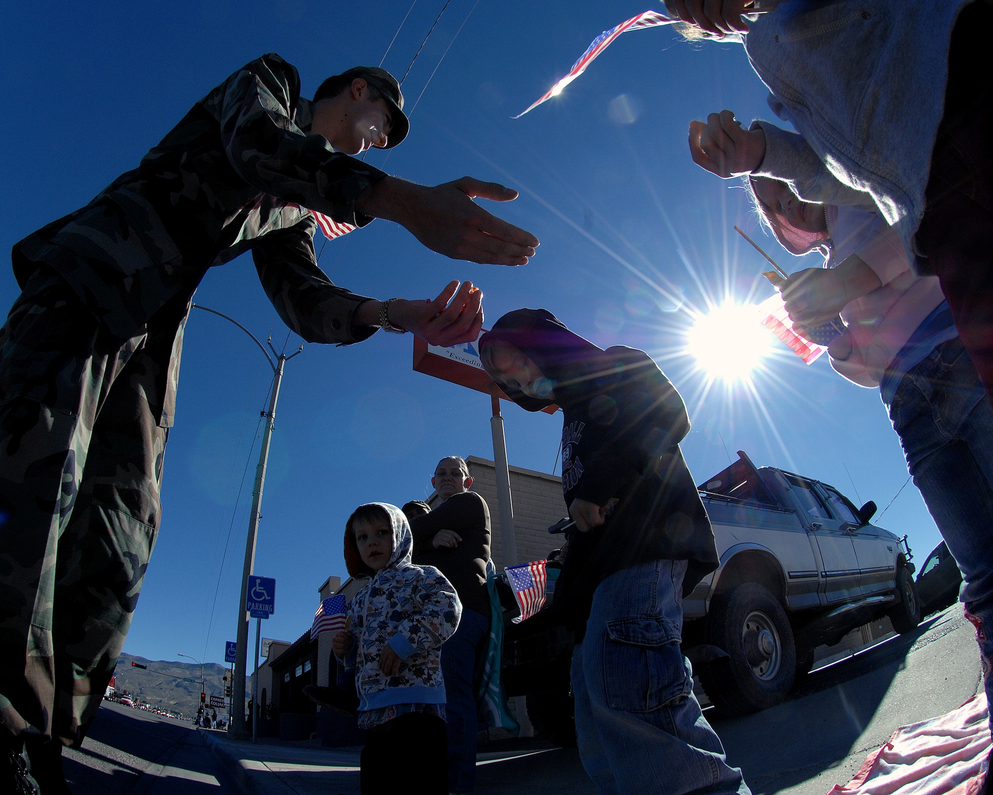 Airman 1st Class Collier Buffington, 49th Logisitics Readiness Squadron, Holloman Air Force Base, N.M., passes out candy to children during the Veterans Day parade Nov. 8, in Alamogordo, N.M. The Veterans Day National Ceremony is held Nov. 11 each year at Arlington National Cemetery.



(U.S. Air Force photo/ Senior Airman Anthony Nelson)
