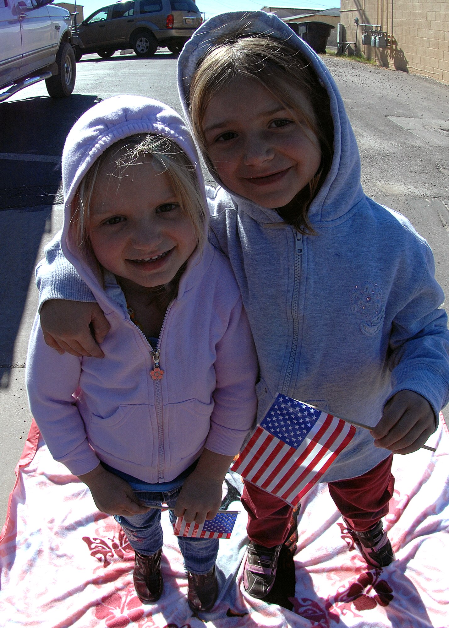 Two young children smile as military members of Otero County pass out candy during the Veterans Day parade Nov. 8, in Alamogordo, N.M.The Veterans Day National Ceremony is held Nov. 11 each year at Arlington National Cemetery. A color guard made up of members from each of the military services, renders honors to America's war dead during a tradition-rich ceremony at the Tomb of the Unkowns.



(U.S. Air Force photo/ Senior Airman Anthony Nelson)
