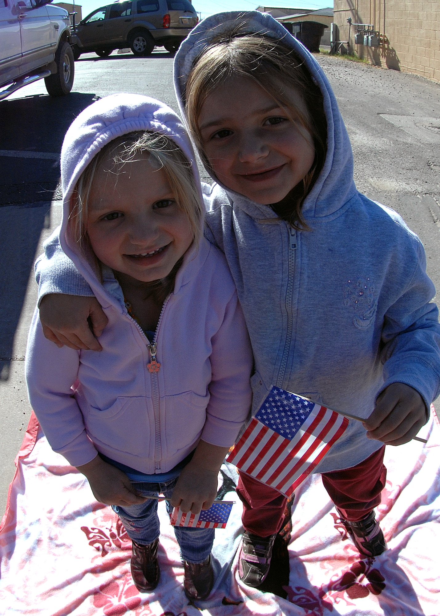 Two young children smile as military members of Otero County pass out candy during the Veterans Day parade Nov. 8, in Alamogordo, N.M.The Veterans Day National Ceremony is held Nov. 11 each year at Arlington National Cemetery. A color guard made up of members from each of the military services, renders honors to America's war dead during a tradition-rich ceremony at the Tomb of the Unkowns.



(U.S. Air Force photo/ Senior Airman Anthony Nelson)
