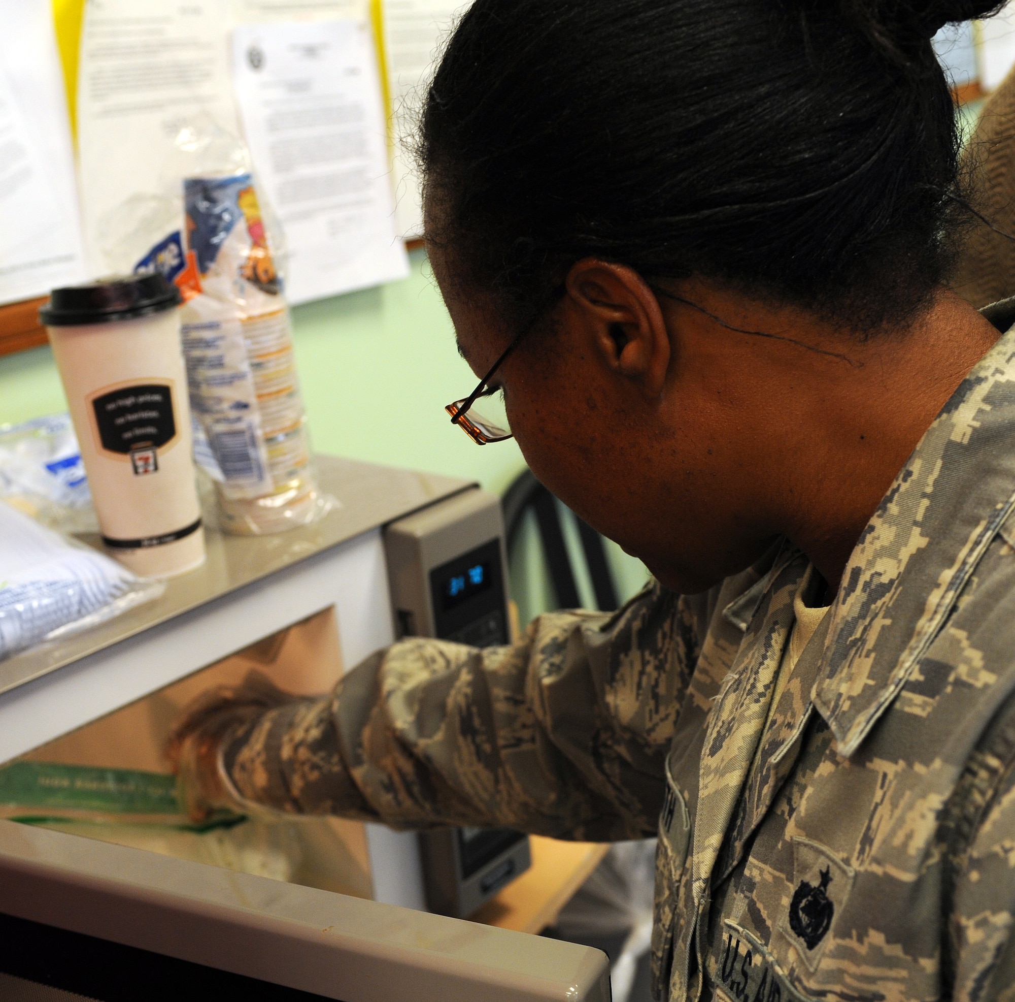 LANGELY AIR FORCE BASE, Va. -- Tech. Sgt. Andrea Smith, 735th Supply Chain Management Group supply craftsman, pulls her omelet out of the microwave after making sure it was cooked thoroughly Nov. 13. The "How To Make a Meal using only a Microwave Bag" class showed participants how to make something healthy in a quick and easy manner. (U.S. Air Force photo/Airman 1st Class Zachary Wolf)