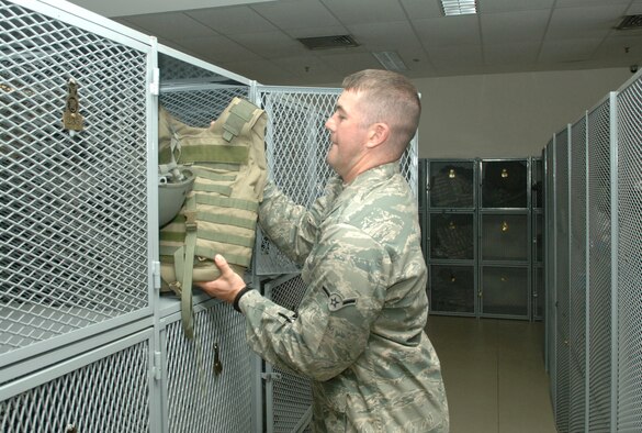 Airman Thomas Potter, 39th Security Forces Squadron member, stows gear
in his locker after working a 12-hour shift. Airman Potter is one of 13 Beale
security forces Airmen who deployed here to augment Incirlik’s security forces. (U.S. Air Force photo by Tech. Sgt. Ray Bowden)