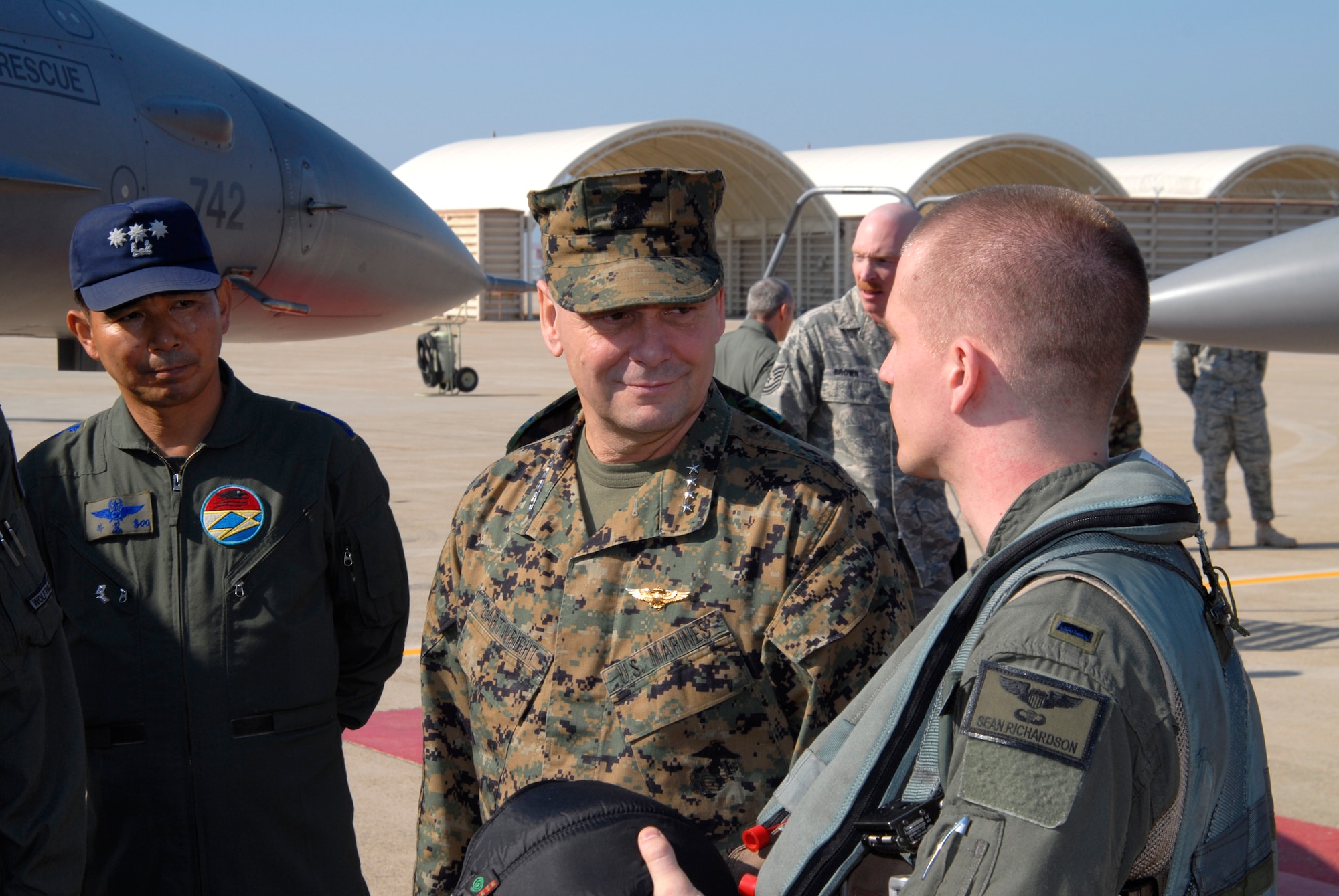 First Lieutenant Sean Richardson, 80th Fighter Squadron, briefs Marine Gen. James E. Cartwright, Vice Chairman of the Joint Chiefs of Staff, on the capablities of the F-16 Fighting Falcons assigned to Kunsan Air Base, Republic of Korea, Nov. 12, 2008. General Cartwright came to Kunsan along with a United Service Organizations entertainment show in support of the military members stationed in Korea. (U.S. Air Force Photo by SSgt Jason Colbert)