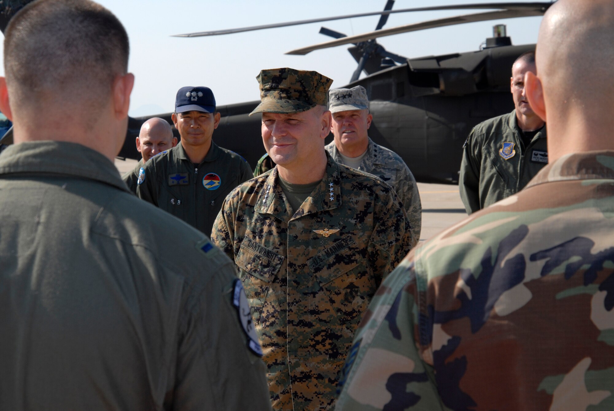 Marine Gen. James E. Cartwright, Vice Chairman of the Joint Chiefs of Staff, is briefed on the 8th Fighter Wing's mission by Wolf Pack Airmen at Kunsan Air Base, Republic of Korea, Nov. 12, 2008. General Cartwright came to Kunsan along with a United Service Organizations entertainment show in support of the military members stationed in Korea. (U.S. Air Force Photo by SSgt Jason Colbert)