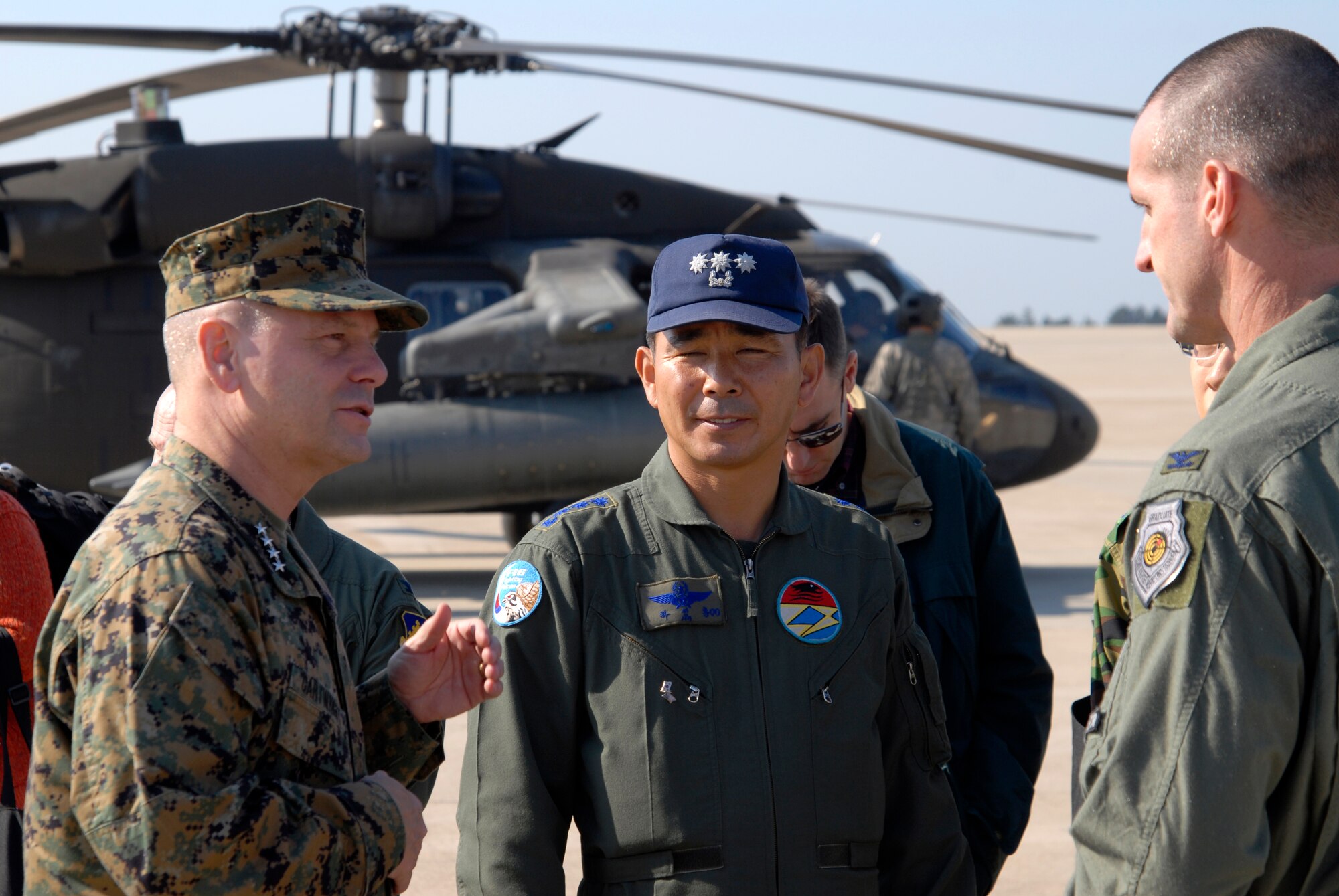 Marine Gen. James E. Cartwright, Vice Chairman of the Joint Chiefs of Staff, speaks with Republic of Korea Air Force Col. Ha, Sung Ryong, 38th Fighter Group commander and Col. Peter Gersten, 8th Operations Group commander, at Kunsan Air Base, Republic of Korea, Nov. 12, 2008. General Cartwright came to Kunsan along with a United Service Organizations entertainment show in support of the military members stationed in Korea. (U.S. Air Force Photo by SSgt Jason Colbert)
