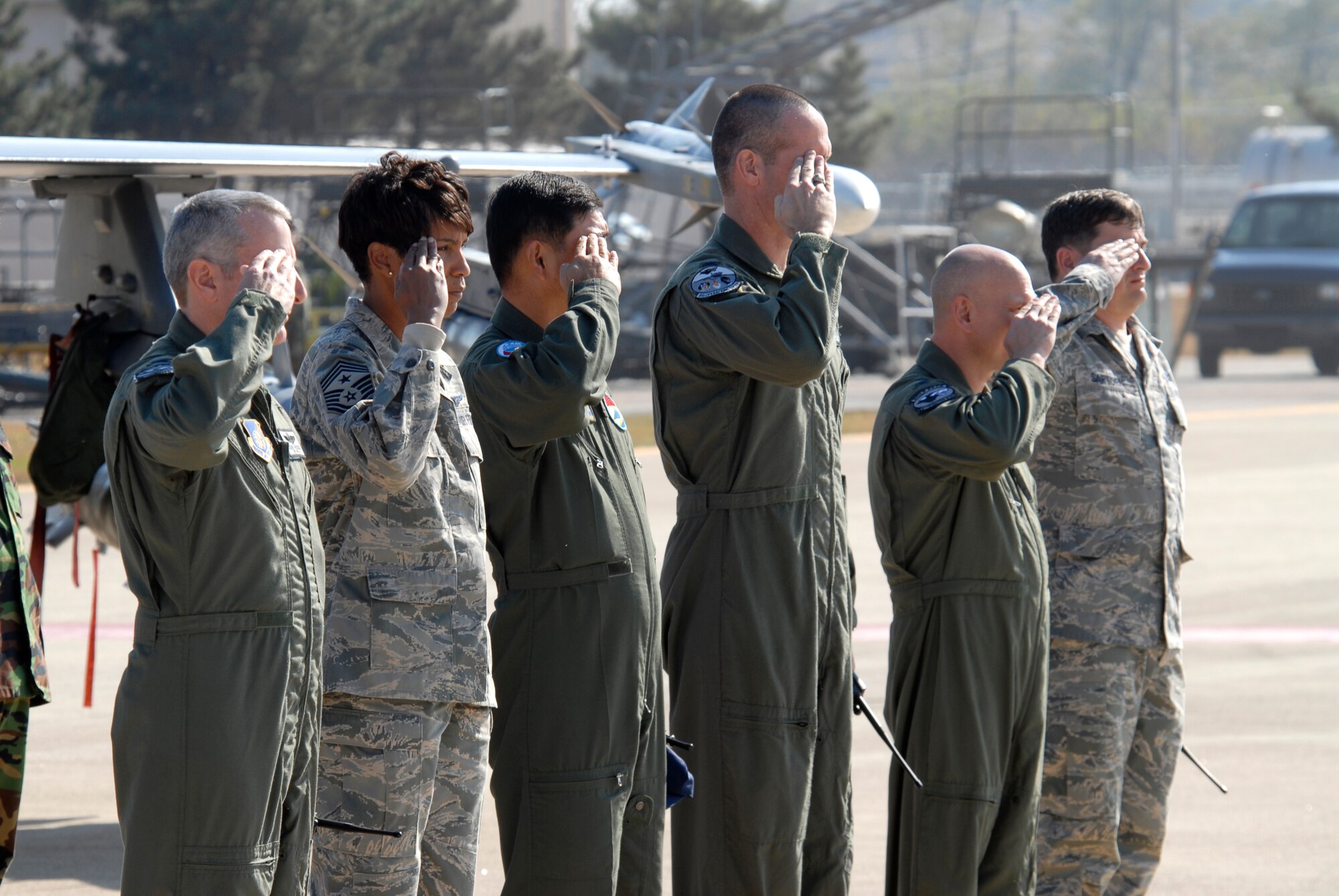 8th Fighter Wing leadership salutes Marine Gen. James E. Cartwright, Vice Chairman of the Joint Chiefs of Staff, as he taxies in at Kunsan Air Base, Republic of Korea, Nov. 12, 2008. General Cartwright came to Kunsan along with a United Service Organizations entertainment show in support of the military members stationed in Korea. (U.S. Air Force Photo by SSgt Jason Colbert)