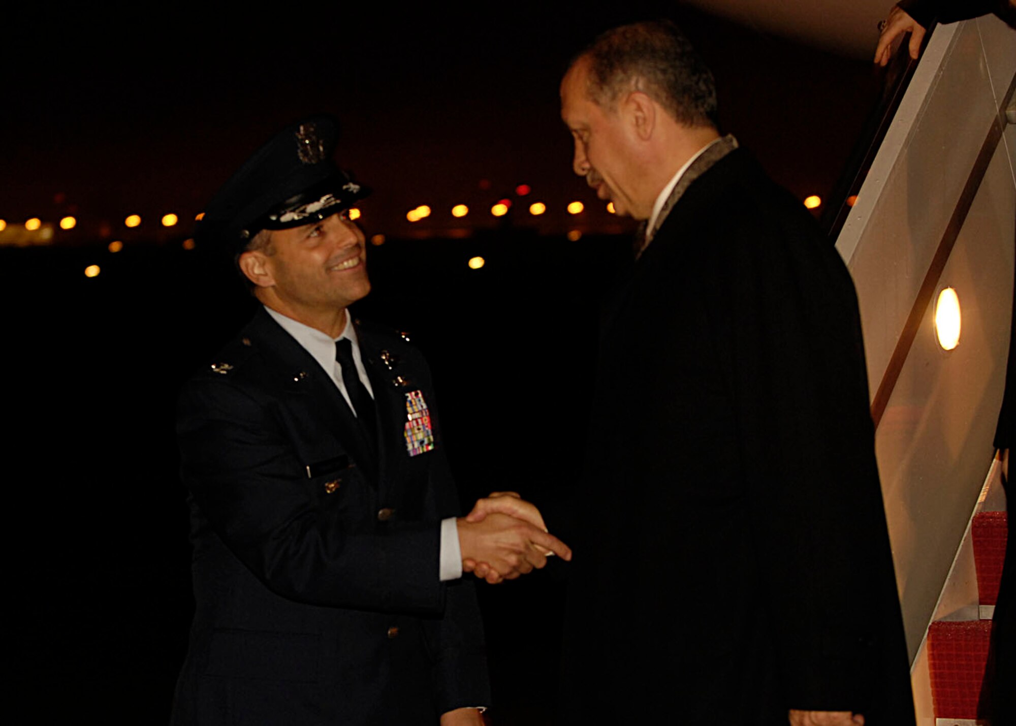 Colonel Eric A. Snadecki, 316th Wing vice commander, greets Turkish Prime Minister Tayyip Erdogan at Andrews Air Force Base, Md.,  Nov. 14, 2008, for the two-day G20 Summit at the White House in Washington. The summit, hosted by U.S. President George W. Bush, will bring together world leaders to discuss the increasing global financial crisis, its causes and efforts to resolve it. (U.S. Air Force photo by Senior Airman Steven R. Doty)