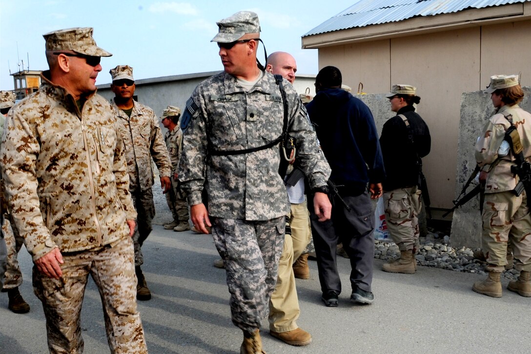 Vice Chairman of the Joint Chiefs of Staff U.S. Marine Gen. James E. Cartwright talks to U.S. Army Lt. Col. David Chase during a visit to Forward Operating Base Fenty, Afghanistan, Nov. 13, 2008. Chase, deputy commander of the 3rd Brigade Combat Team, 2nd Infantry Division, provided Cartwright updates to operations in the area.