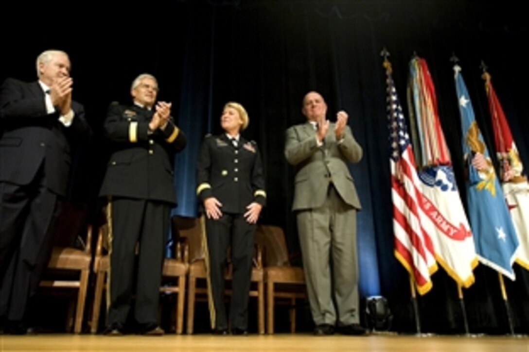 Army Gen. Ann E. Dunwoody, receives applause for her promotion to general by Defense Secretary  Robert Gates, Chief of Staff of the Army Gen. George W. Casey Jr., and her husband Craig Brotchie at the Pentagon in Washington D.C., Nov. 14, 2008.  Dunwoody is the first woman to reach the rank of four-star general in the history of the United States military.