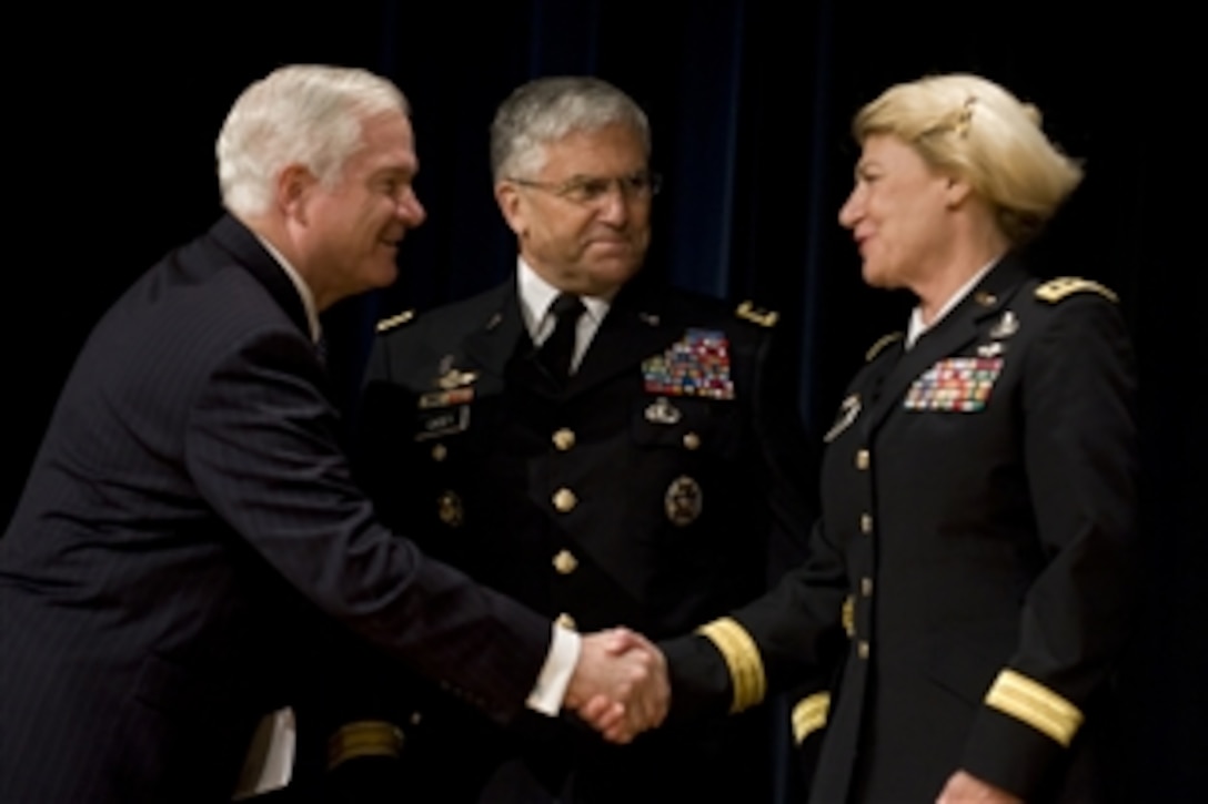 Defense Secretary Robert M. Gates shakes hands with newly promoted Army Gen. Ann E. Dunwoody, at her promotion ceremony in the Pentagon, Washington, D.C., Nov. 14, 2008. Dunwoody is the first woman to reach the rank of four-star general in the history of the United States military.