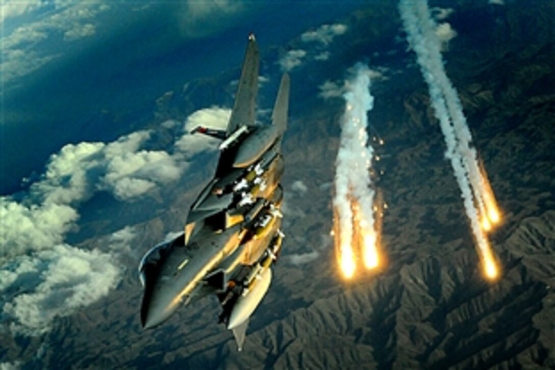 A U.S. Air Force F-15E Strike Eagle aircraft from the 391st Expeditionary Fighter Squadron deploys flares during a flight over Afghanistan, Nov. 12, 2008. The squadron is deployed to Bagram Air Base.