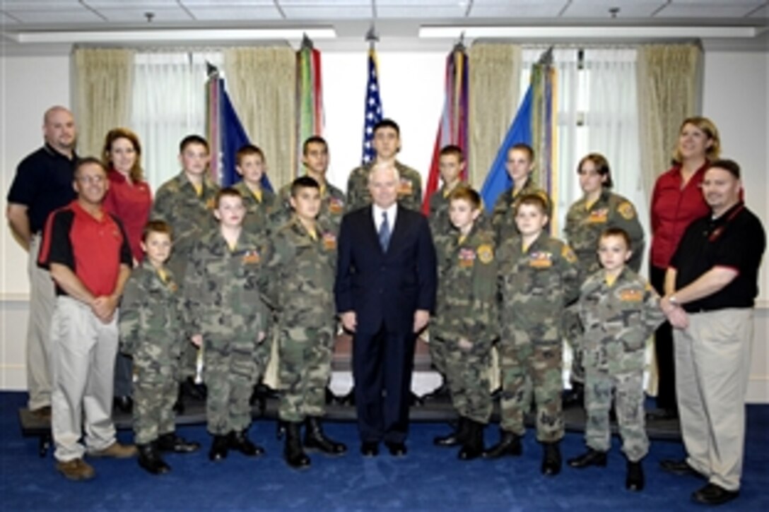 Defense Secretary Robert M. Gates, middle front, poses for a group photo with the Greater Lake County Young Marines from Ohio during their visit to the Pentagon Nov. 14, 2008.