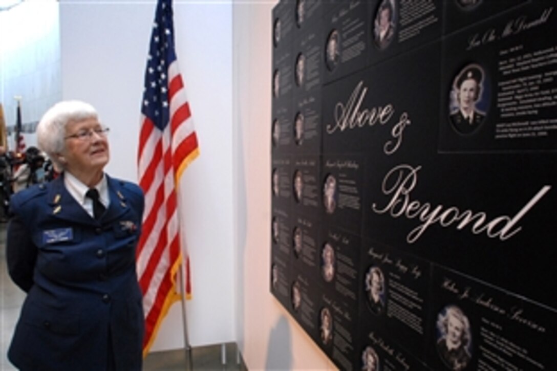 Elaine D. Harmon walks through the "Fly Girls of World War II" exhibit during the exhibit's opening Nov. 14, 2008, at the Women in Military Service for America Memorial in Arlington, Va. Harmon is a former member of the Women Airforce Service Pilots, or WASP, program. The WASP were the first U.S. military-trained women pilots.