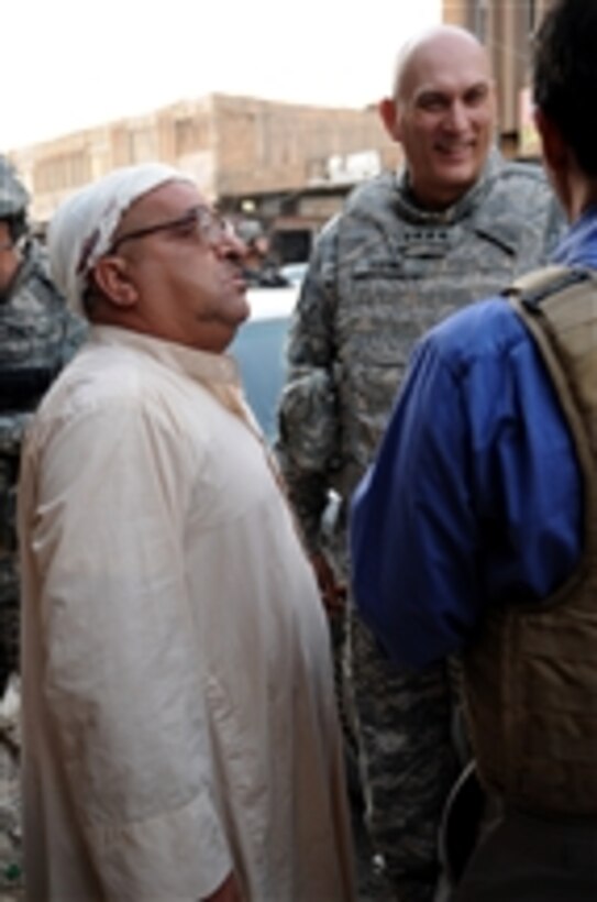 Commanding General of Multi-National Force-Iraq Gen. Ray Odierno, U.S. Army, visits with local residents to discuss living conditions in the city of Samarra, Iraq, on Oct. 29, 2008.  