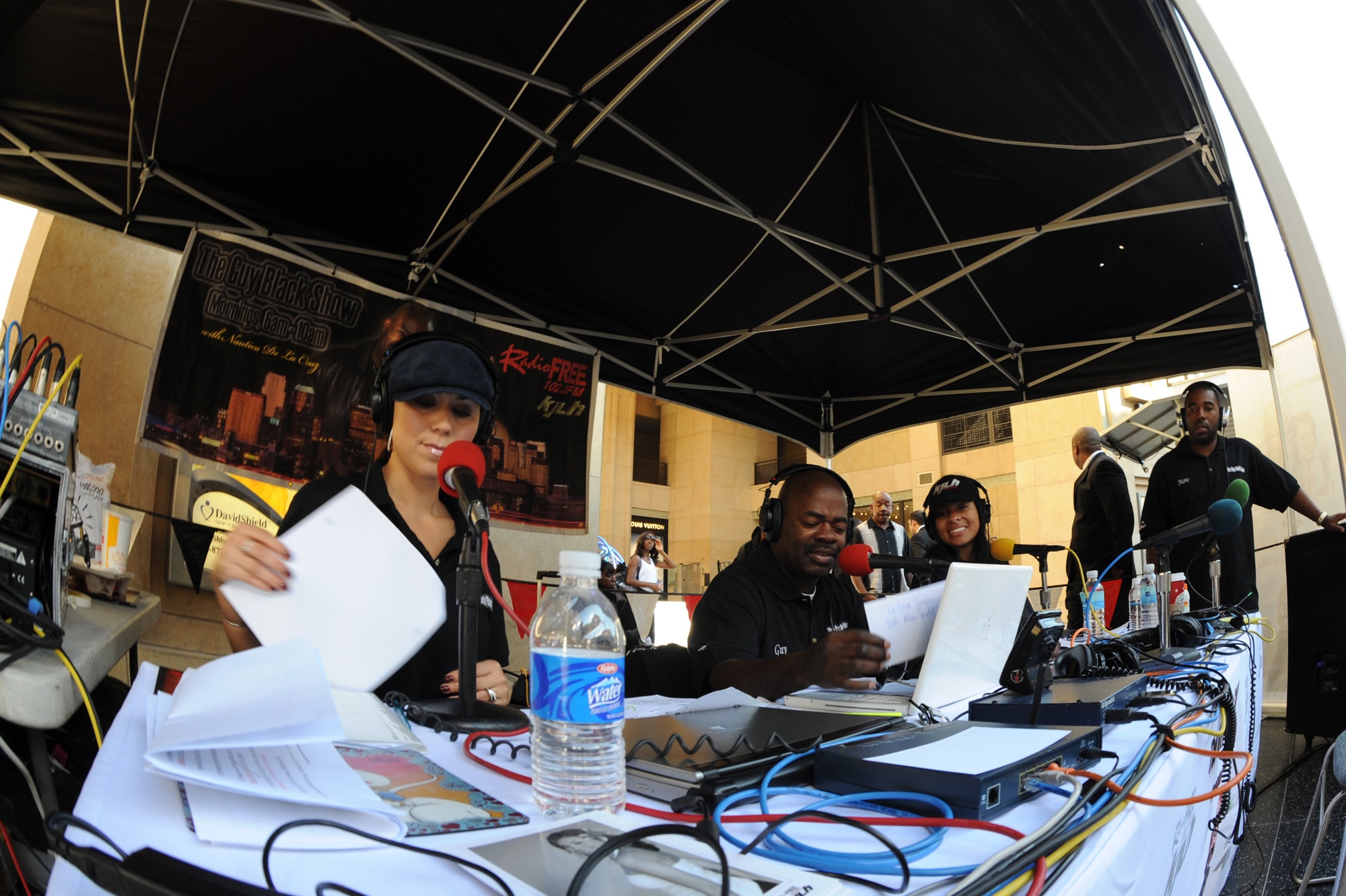 Nautica de la Cruz, Guy Black and Adai Lamar host a live show of, "The Guy Black Show," on 102.3 FM KJLH, a local Los Angeles radio station, during the Air Force Expo at Hollywood and Highland Boulevard in Los Angeles on Nov. 14. The radio hosts salute the men and women in uniform as they celebrate Air Force Week. Air Force Week Los Angeles runs until Nov. 21 and has events throughout the area.  (U.S. Air Force photo/Staff Sgt. Desiree N. Palacios)

