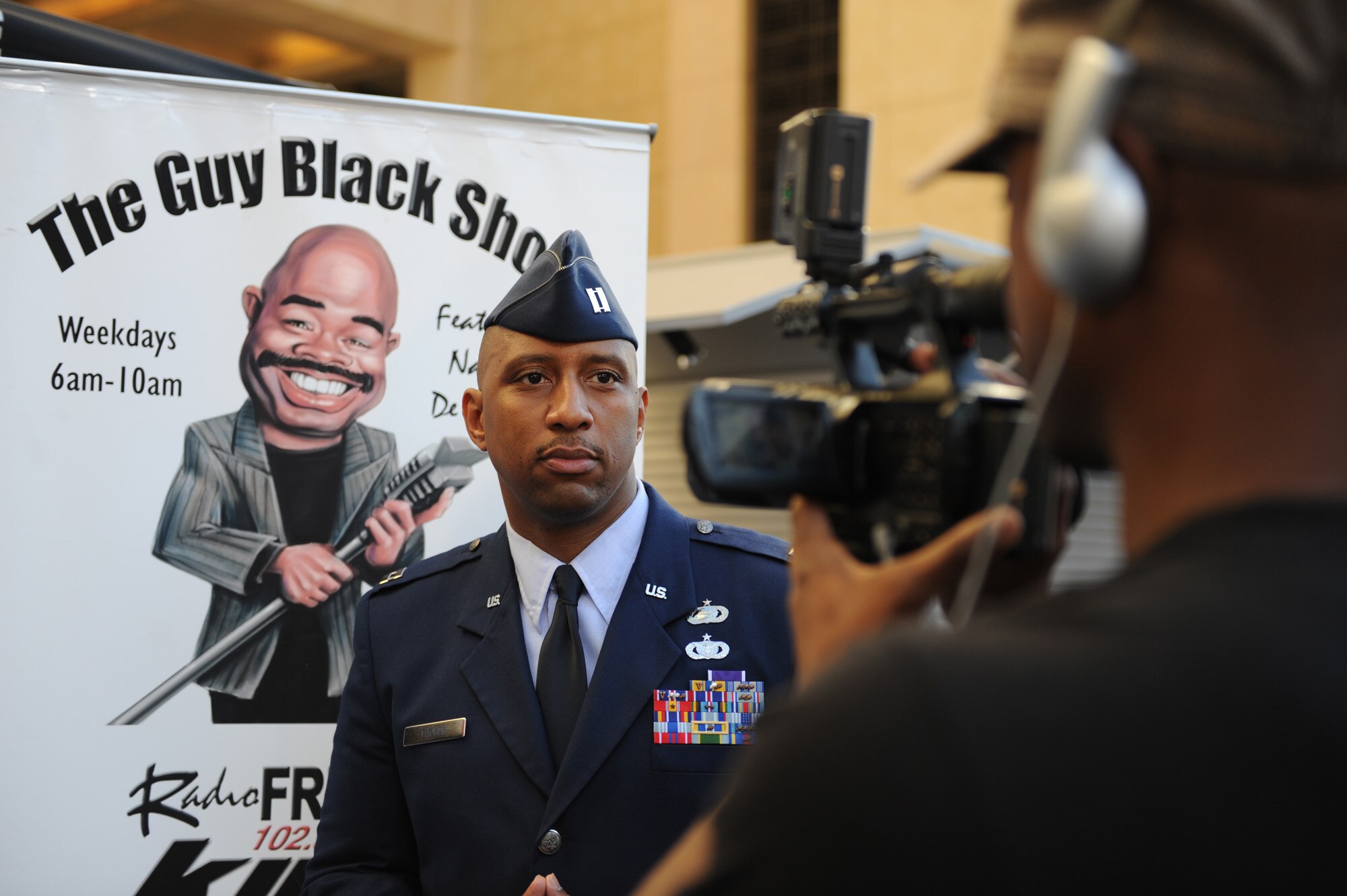 Capt. Grady Tucker does an interview on, "The Guy Black Show," during the Air Force Expo at Hollywood and Highland Boulevard in Los Angeles on Nov. 14. Air Force Week Los Angeles runs until Nov. 21 and has events throughout the area. Captain Tucker is the commander of the military personnel element at Los Angeles Air Force Base, Calif. "The Guy Black Show" runs on a local Los Angeles radio station. (U.S. Air Force photo/Staff Sgt. Desiree N. Palacios)

