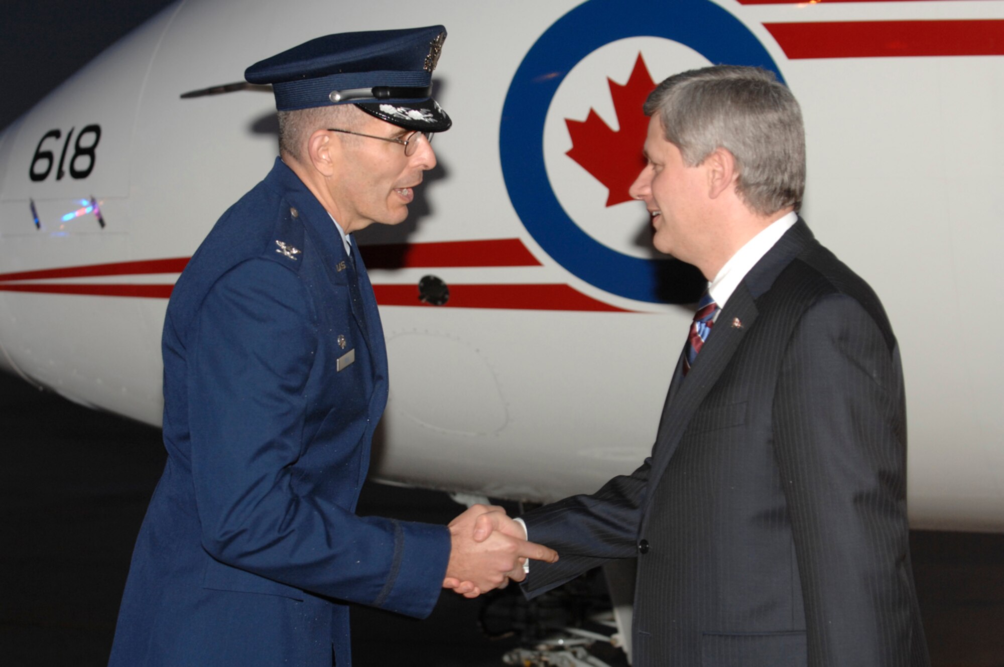 Colonel Clair Gilk, 316th Operations Group commander, greets Canadian Prime Minister Stephen Harper  at Andrews Air Force Base, Md., Nov. 14, 2008, for the two-day G20 Summit at the White House in Washington. The summit, hosted by U.S. President George W. Bush, will bring together world leaders to discuss the increasing global financial crisis, its causes and efforts to resolve it. (U.S. Air Force photo by Tech. Sgt. Craig Clapper)