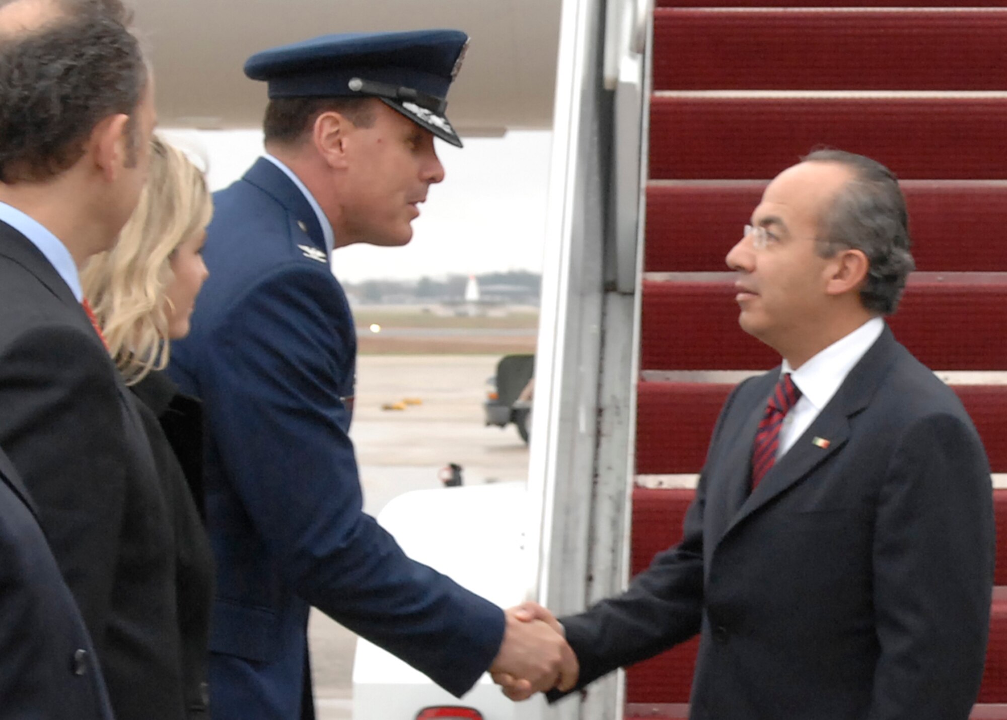 Colonel Steven M. Shepro, 316th Wing commander, greets Mexican President Felipe Calderon at Andrews Air Force Base, Md., Nov. 14, 2008, for the two-day G20 Summit at the White House in Washington. The summit, hosted by U.S. President George W. Bush, will bring together world leaders to discuss the increasing global financial crisis, its causes and efforts to resolve it. (U.S. Air Force photo by Senior Airman Giang Nguyen)