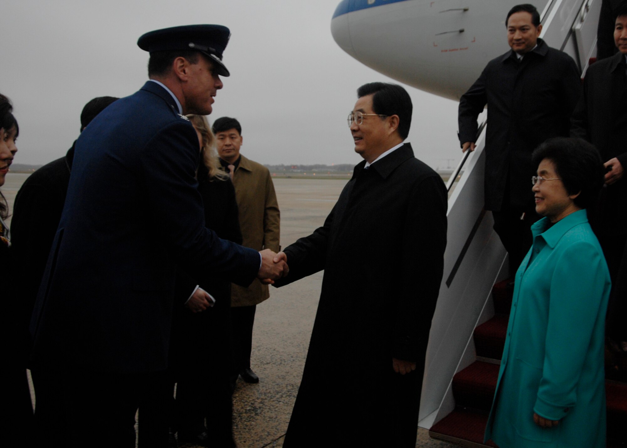 Colonel Steven M. Shepro, 316th Wing commander, greets Chinese President Hu Jintao at Andrews Air Force Base, Md., Nov. 14, 2008, for the two-day G20 Summit at the White House in Washington. The summit, hosted by U.S. President George W. Bush, will bring together world leaders to discuss the increasing global financial crisis, its causes and efforts to resolve it. (U.S. Air Force photo by Airman 1st Class Melissa V. Rodrigues)